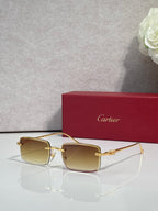 Cartier glasses with gold frame and amber gradient lenses, square silhouette