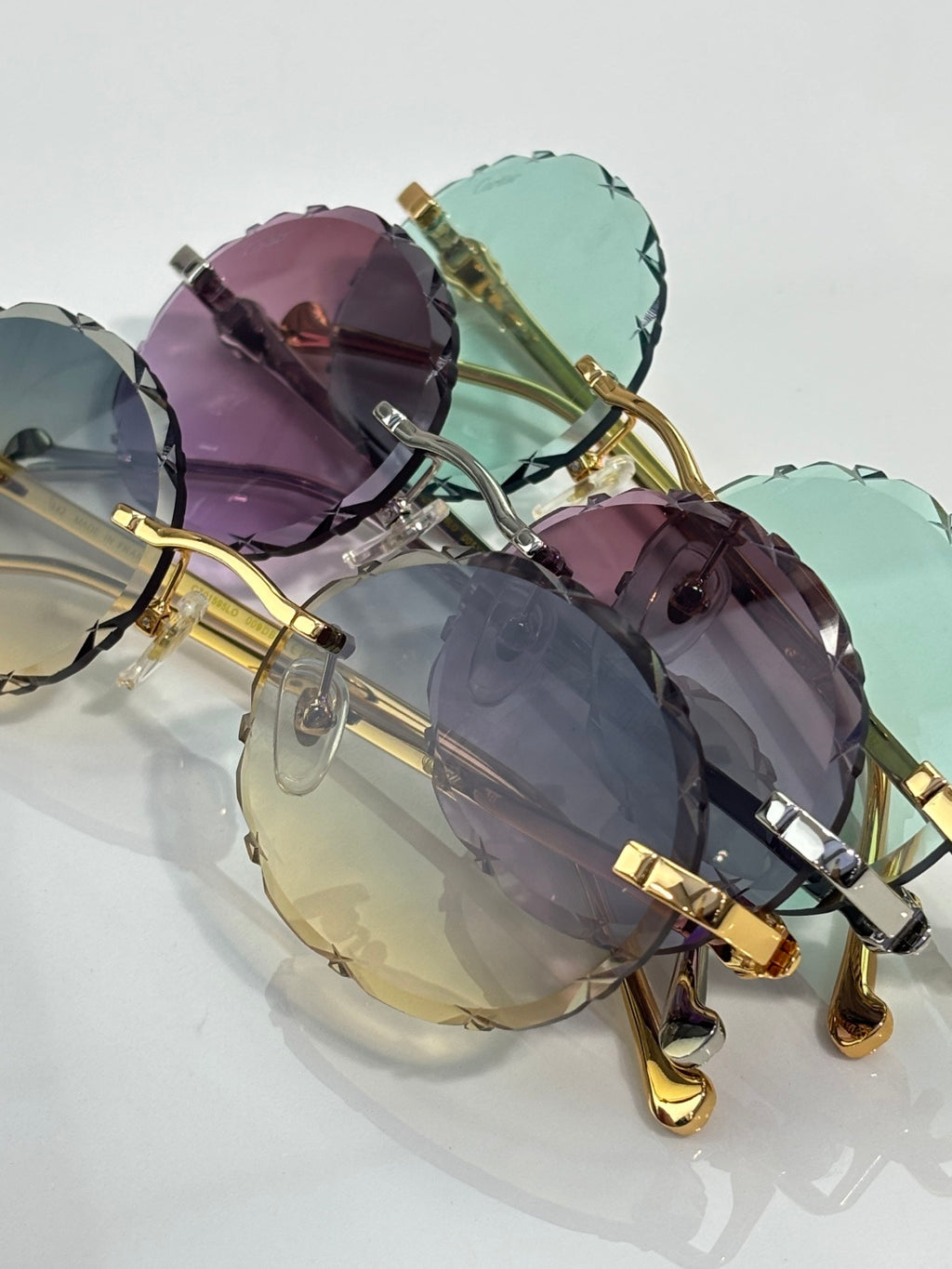 Cartier round eyeglasses close-up with mixed colored tinted lenses and gold frame
