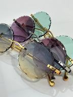 Cartier round eyeglasses close-up with mixed colored tinted lenses and gold frame