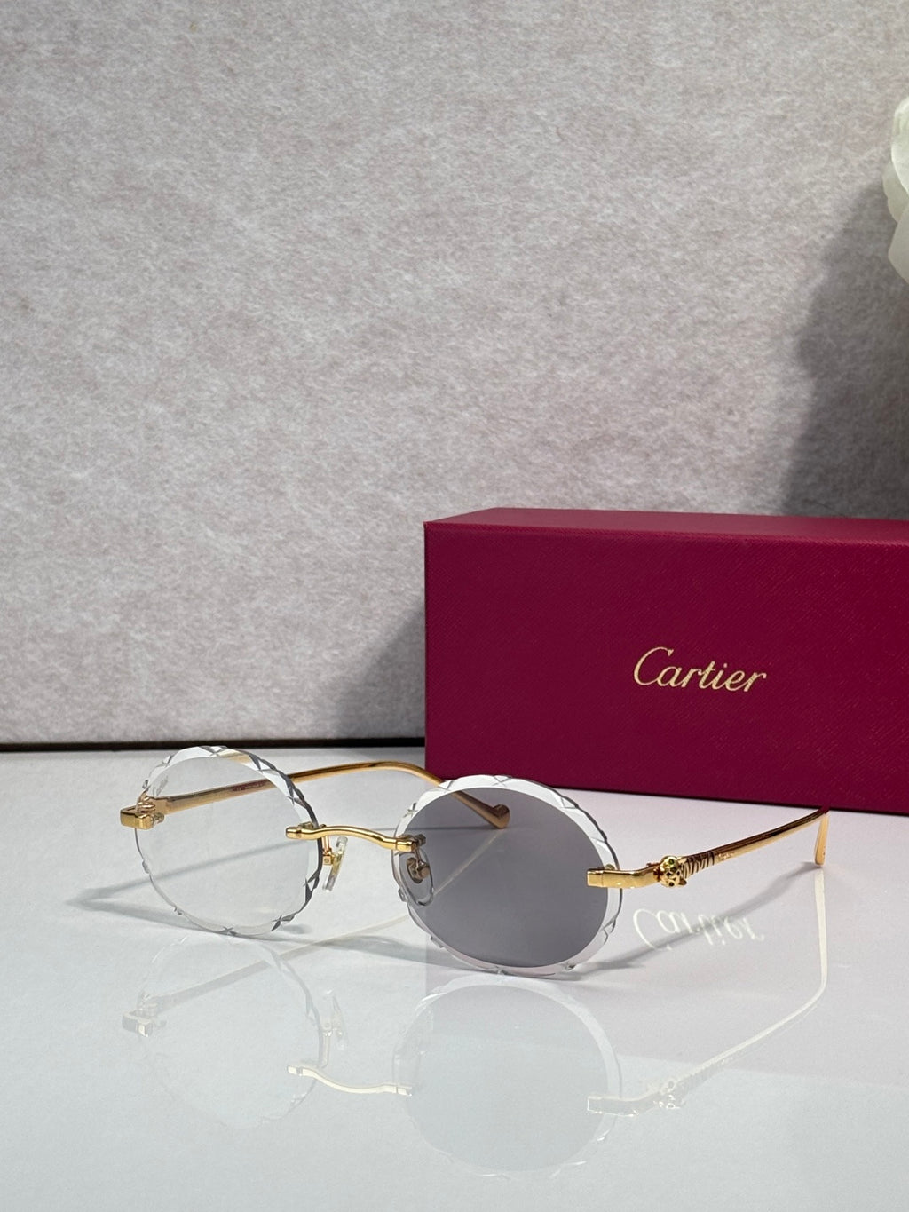 Cartier round eyeglasses with gold-tone metal frame and clear lenses