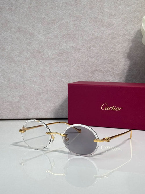 Cartier round eyeglasses with gold-tone metal frame and clear lenses
