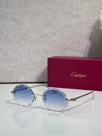 Cartier round eyeglasses with gold-tone frame and blue-tinted lenses