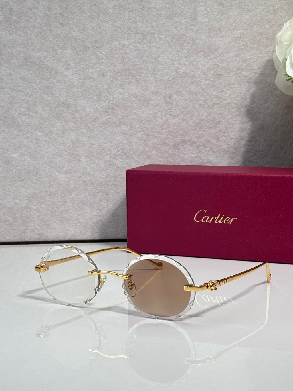 Cartier round eyeglasses with gold-tone frame and light tint lenses