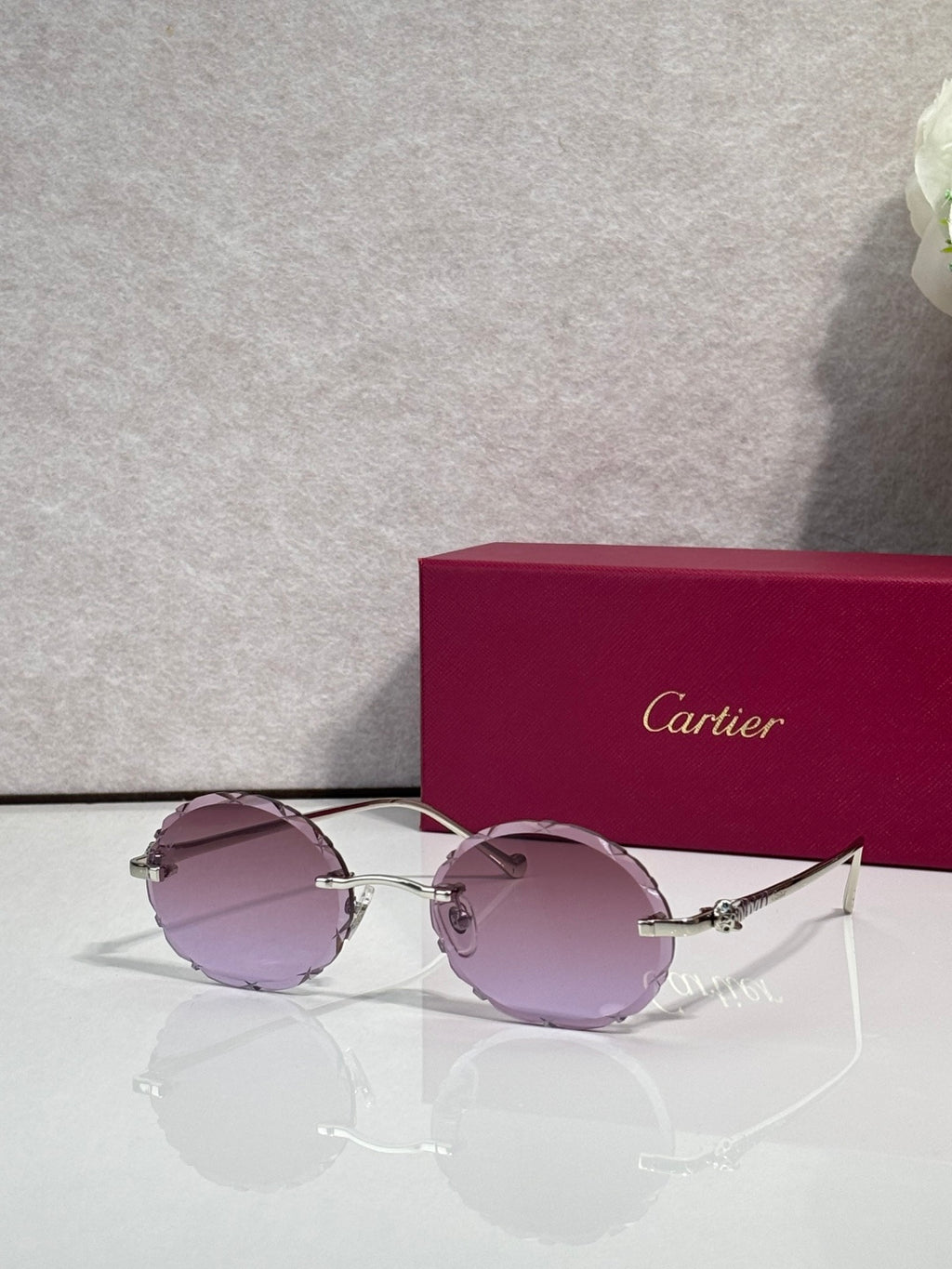 Cartier round sunglasses with silver frame and mauve tinted lenses