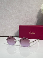 Cartier round sunglasses with silver frame and mauve tinted lenses