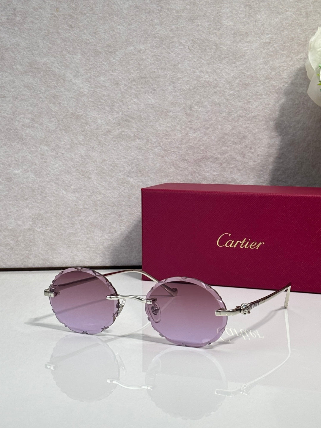 Cartier round sunglasses with silver frame and mauve tinted lenses