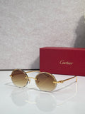 Cartier round sunglasses with gold frame and amber tinted lenses