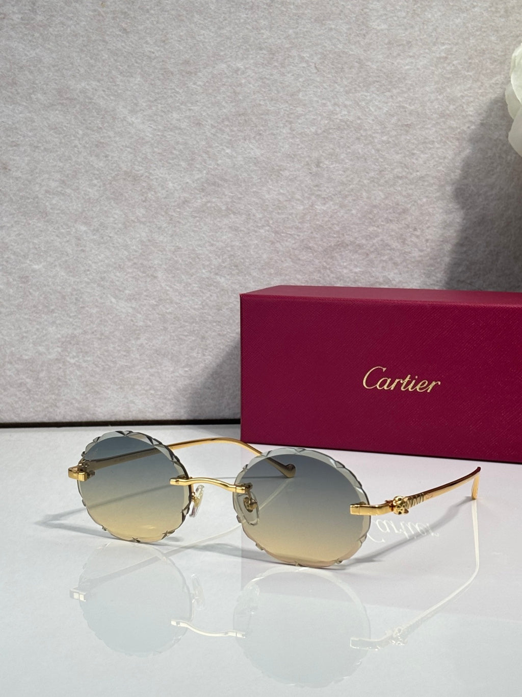 Cartier round sunglasses with gold frame and pale green tinted lenses