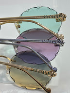 Cartier sunglasses stack: gold frame with mint and purple tinted lenses