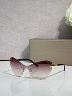 Bvlgari cat-eye sunglasses, maroon frame, rose-tinted lenses, gold accents