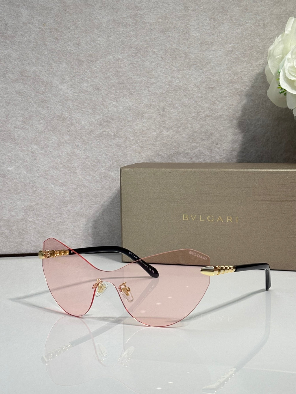 Bvlgari cat-eye sunglasses, burgundy frame, pink-tinted lenses, gold accents