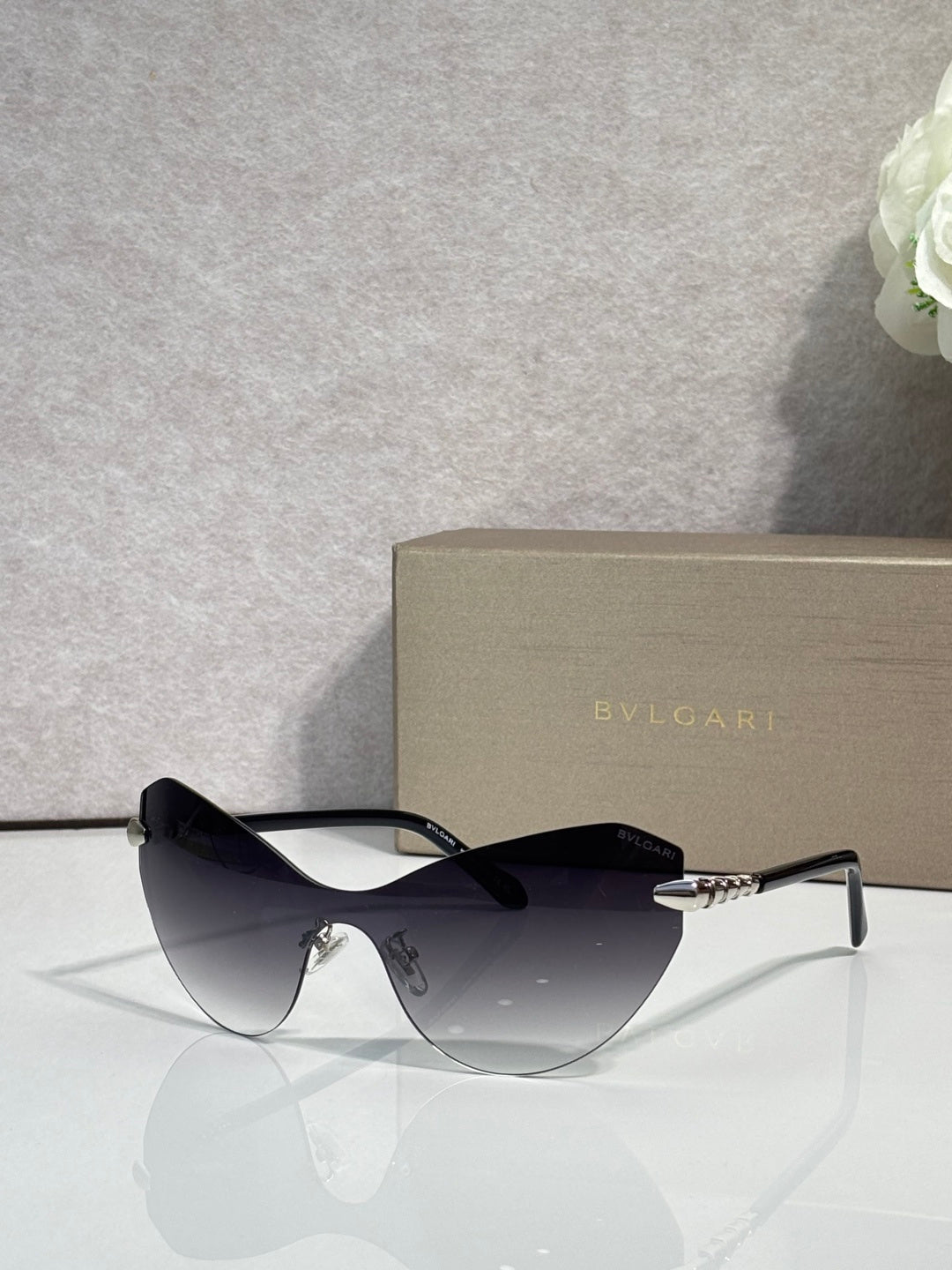 Bvlgari cat-eye sunglasses with black lenses and gold-tone temple details