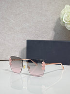Dior sunglasses, gold frame, dark temples, pink gradient lenses, pink floral accents