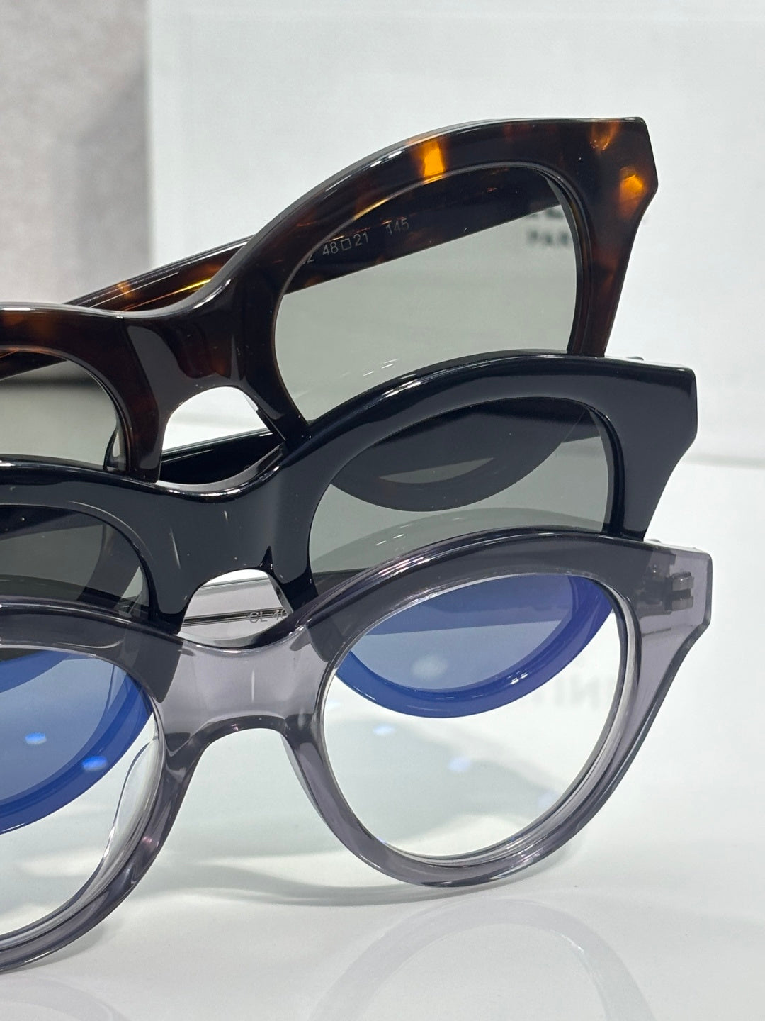 Celine round eyeglass frames with dark acetate and blue-tinted lenses, close-up
