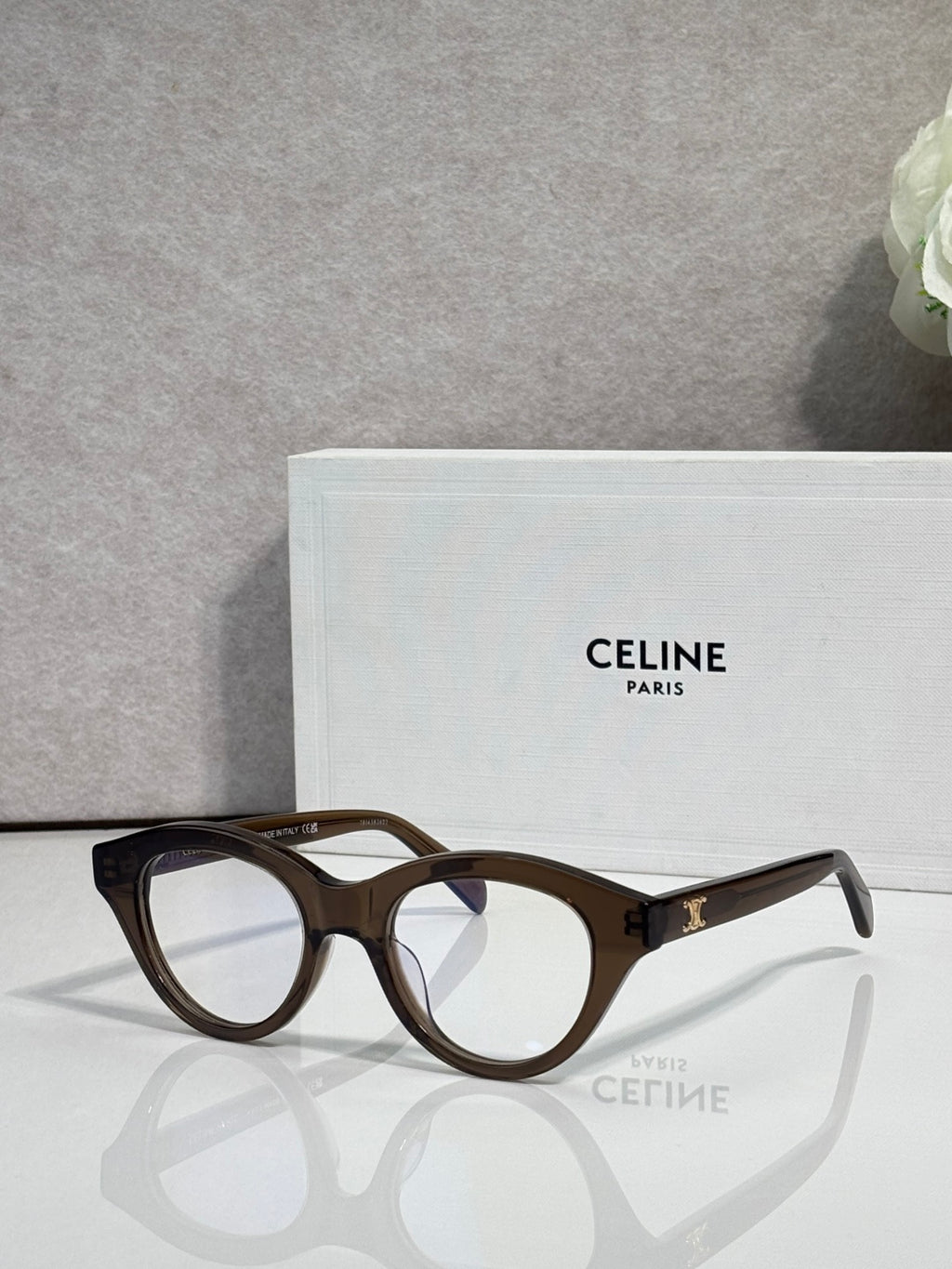 Celine round eyeglasses with tortoise acetate frames and gold-tone logo on temple