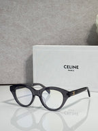 Celine round eyeglasses with black acetate frames and gold-tone logo on temple