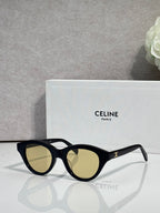 Celine sunglasses with black oval frames and light olive-tinted lenses