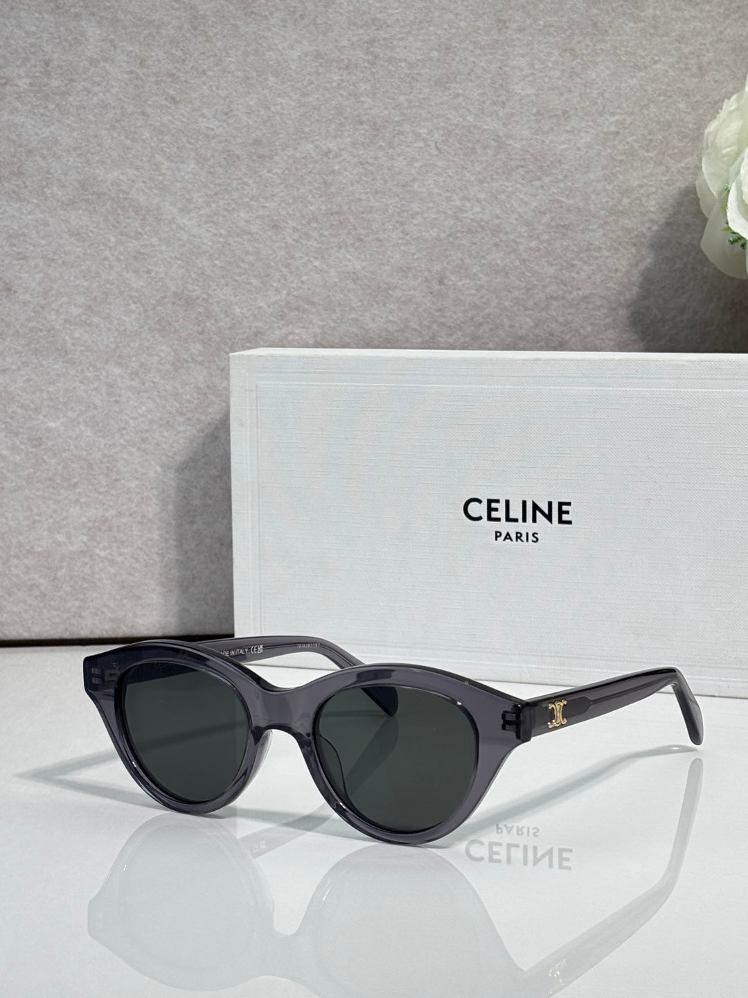 Celine sunglasses with dark frame, tortoiseshell temple tips, and tinted lenses
