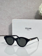 Celine sunglasses with black oval frames and dark-tinted lenses