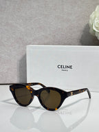Celine sunglasses with tortoiseshell oval frames and dark-tinted lenses