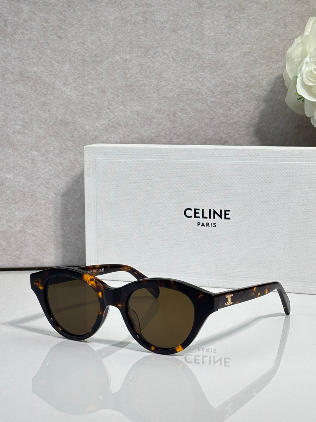 Celine sunglasses with tortoiseshell oval frames and dark-tinted lenses