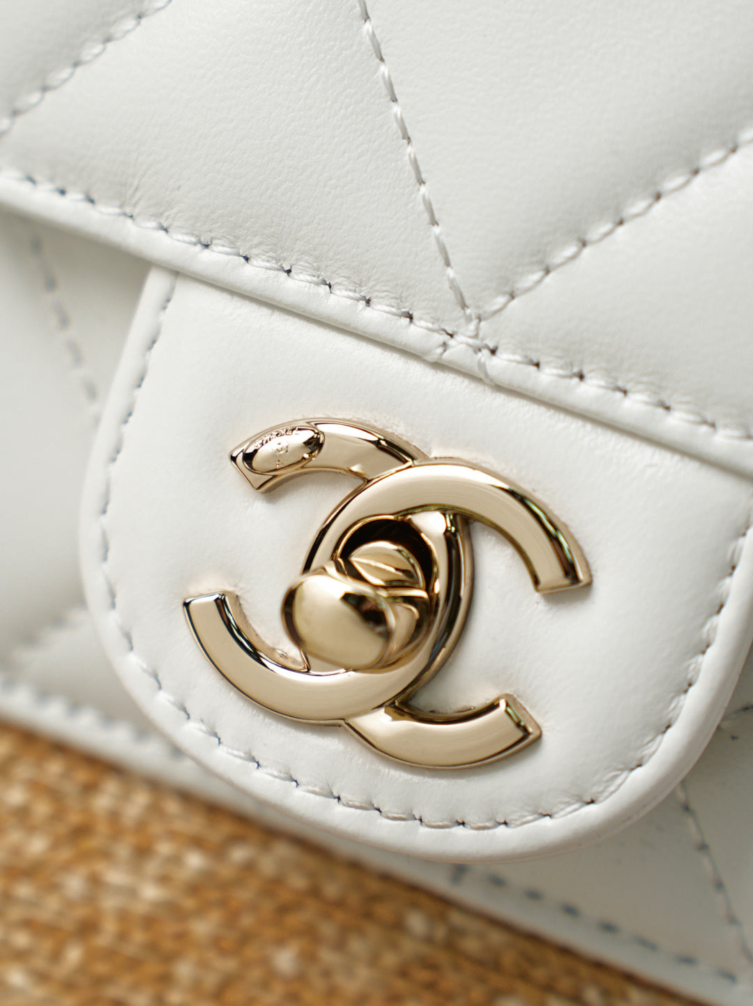 Chanel quilted mini bag front with gold-tone interlocking CC logo