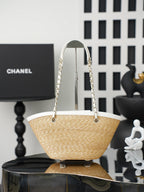 Chanel raffia tote bag with white handles and gold-tone hardware