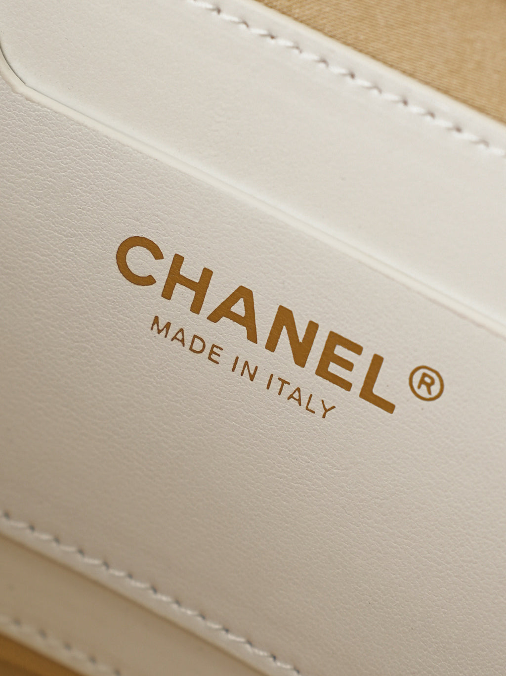Chanel leather label on mini bag reading CHANEL and MADE IN ITALY