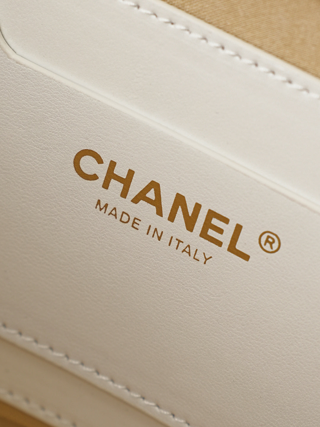 Chanel leather label on mini bag reading CHANEL and MADE IN ITALY