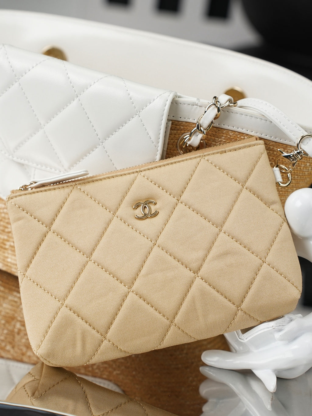 Chanel quilted mini pouch in beige with chain strap and CC logo