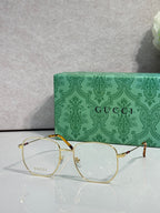 Gucci eyeglasses with gold metal round frame and clear lenses