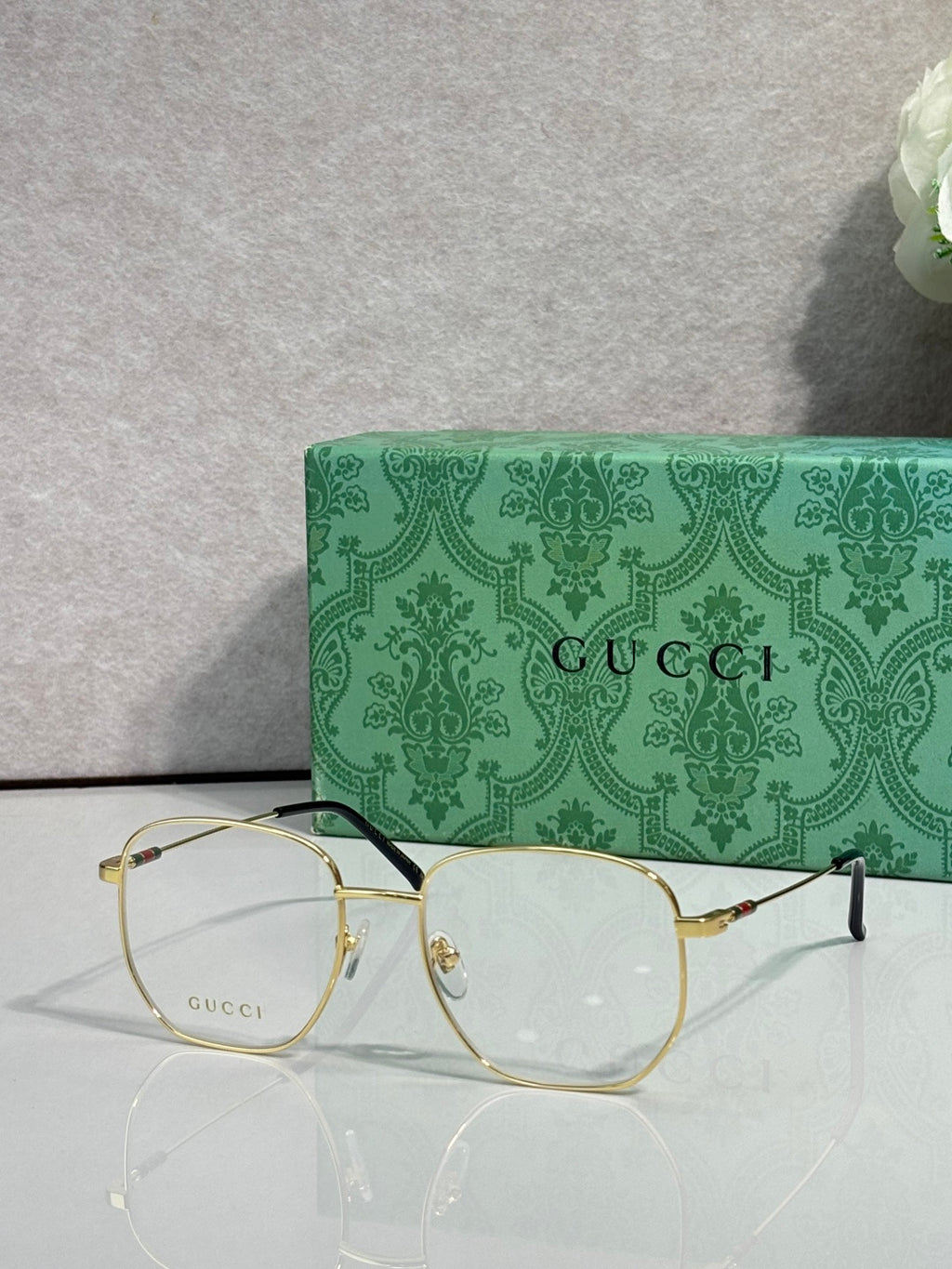 Gucci eyeglasses with gold round frame and clear lenses
