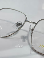 Round metal eyeglass rim with clear lens and engraved bridge detail