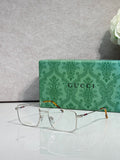 Gucci eyeglasses with silver metal rectangular frames and clear lenses, tortoise temples