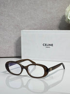 Celine glasses with tortoiseshell-brown frame and dark tinted lenses, gold logo