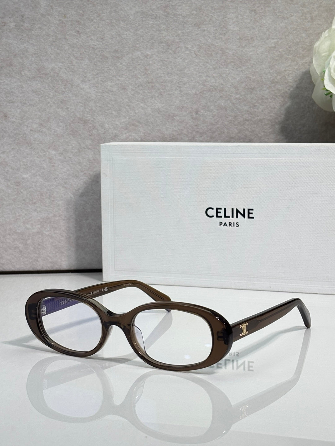 Celine glasses with tortoiseshell-brown frame and dark tinted lenses, gold logo