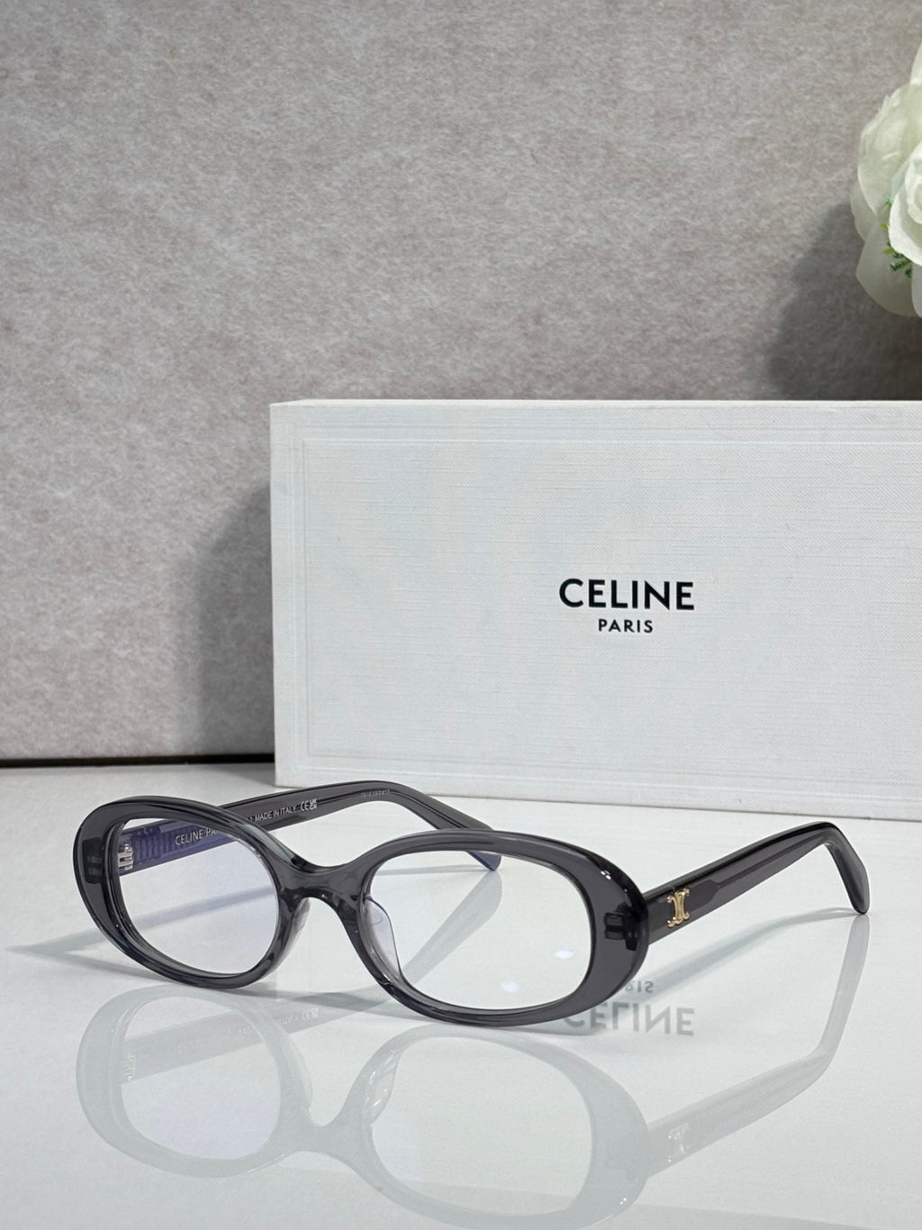 Celine glasses with dark frame and tinted lenses, gold logo temple