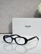 Celine glasses with black frame and blue-tinted lenses, gold logo on temple