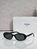 Celine sunglasses with black frame and deep navy tinted oval lenses