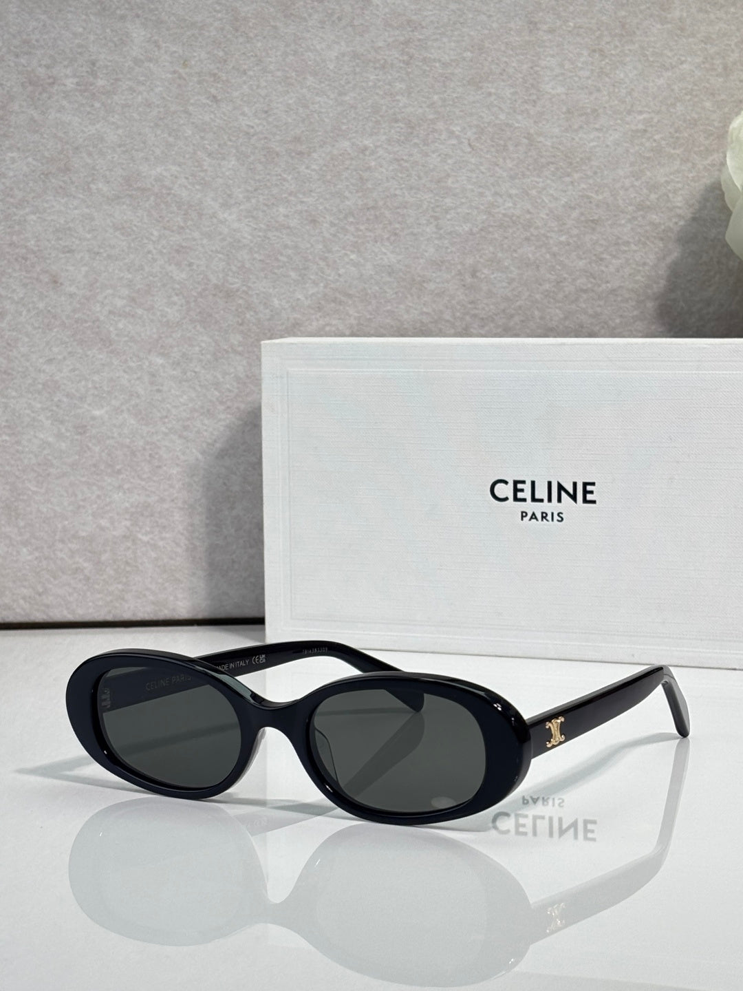 Celine sunglasses with black frame and deep navy tinted oval lenses