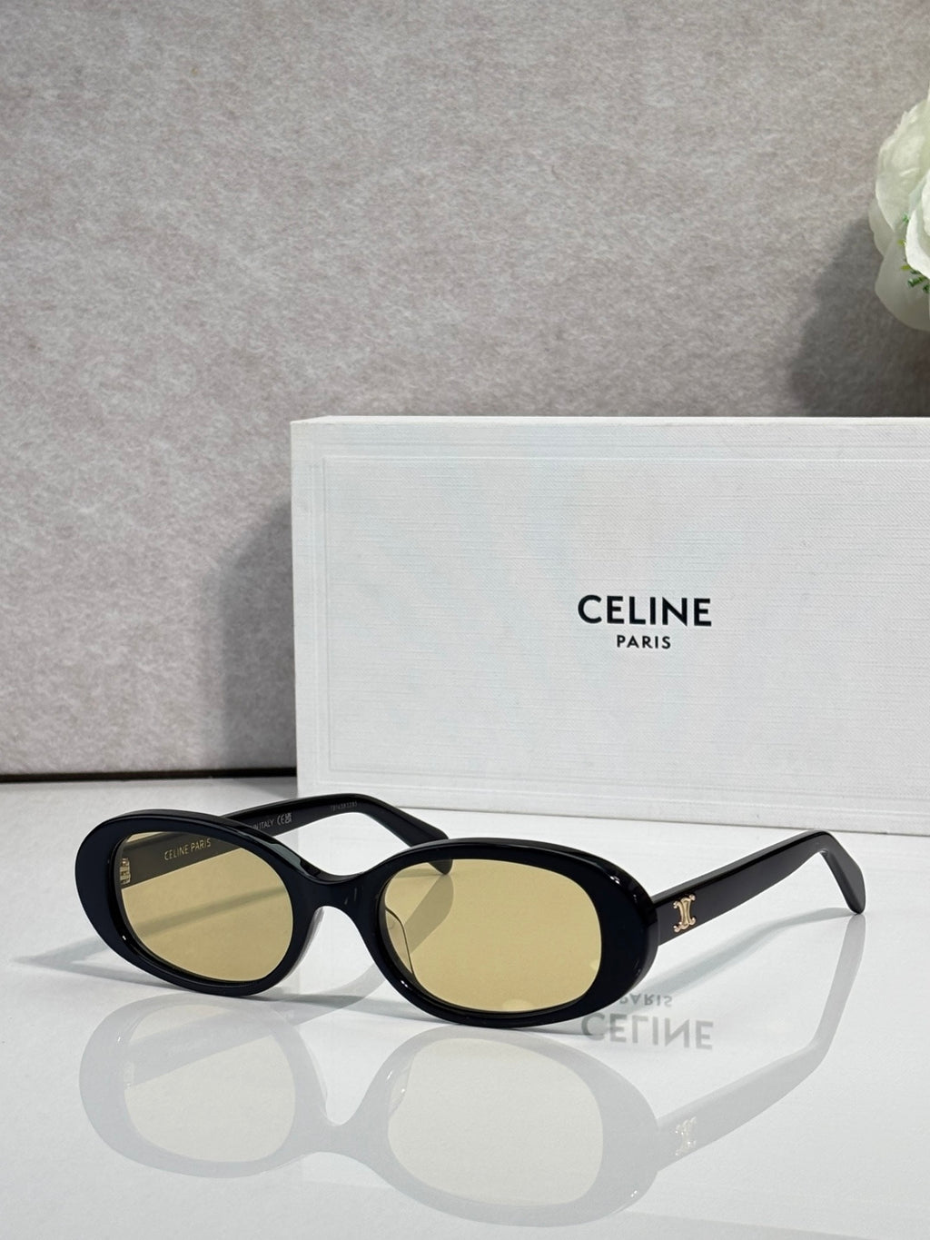 Celine sunglasses with black frame and olive-gold oval lenses