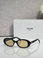 Celine sunglasses with black frame and olive-gold oval lenses