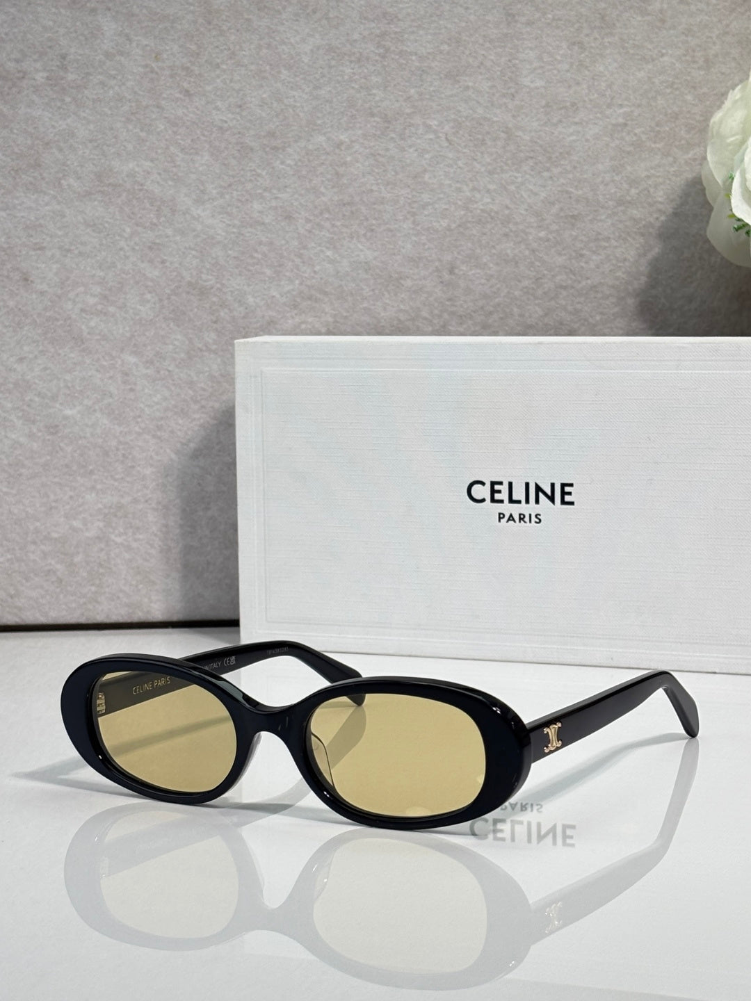 Celine sunglasses with black frame and olive-gold oval lenses
