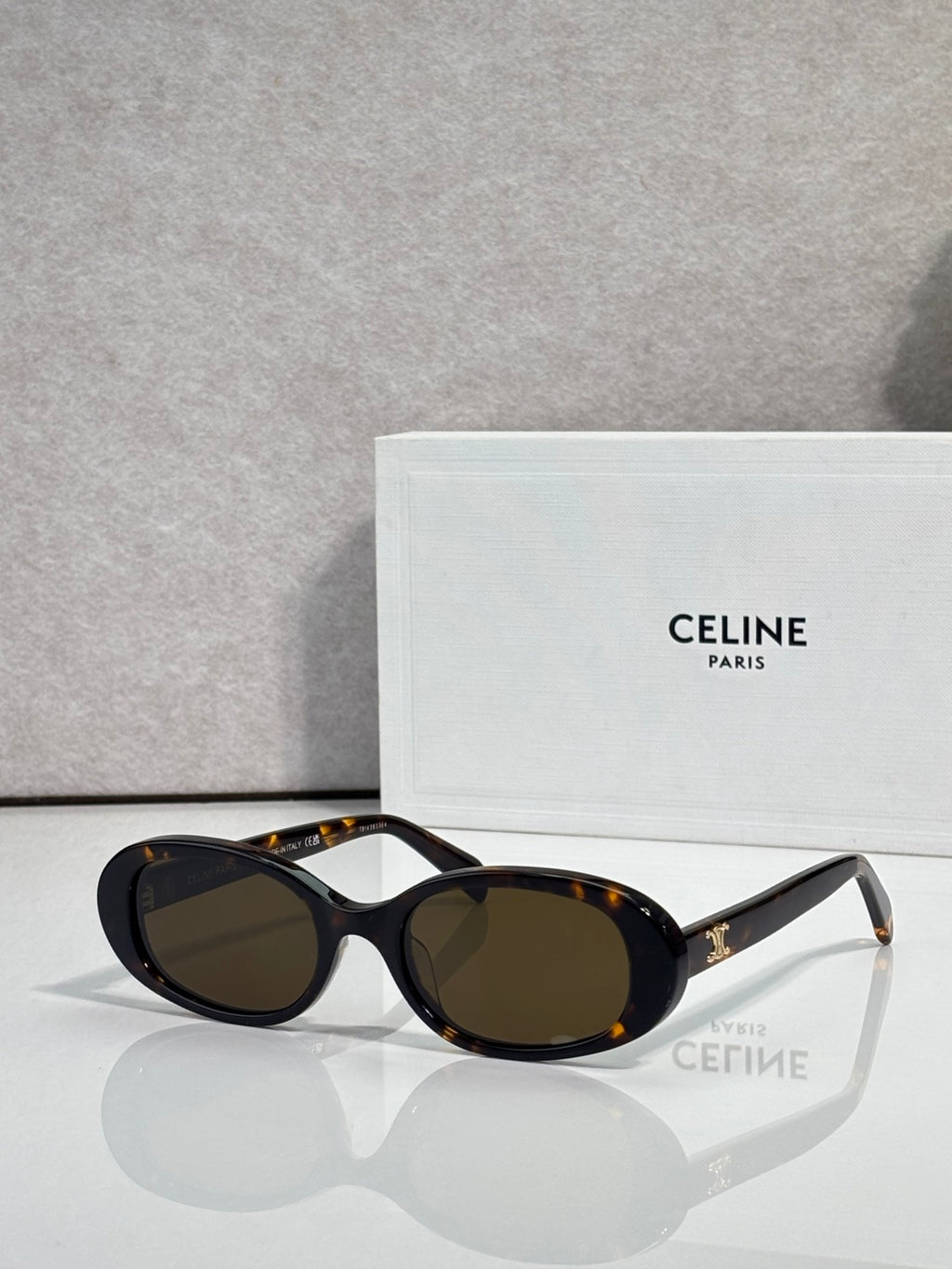 Celine sunglasses with dark tortoiseshell frame and black oval lenses