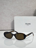 Celine sunglasses with dark tortoiseshell frame and black oval lenses