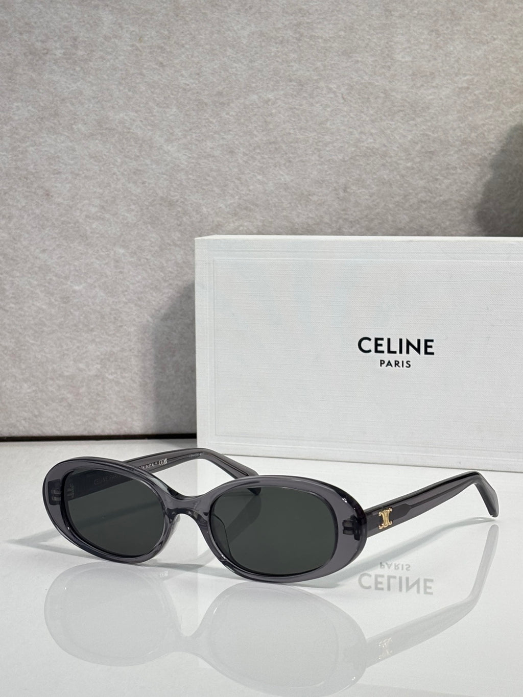 Celine sunglasses with black frame and dark gray oval lenses