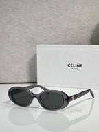 Celine sunglasses with black frame and dark gray oval lenses
