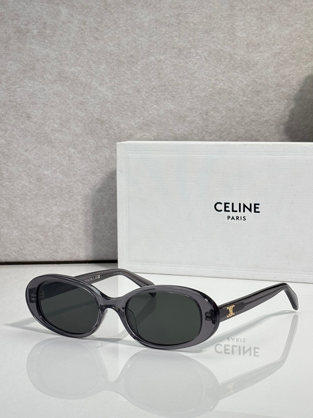 Celine sunglasses with black frame and dark gray oval lenses