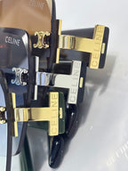 Sunglasses close-up with stacked frames, gold and silver hardware, CELINE branding