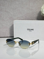 Celine round sunglasses with gold hardware, blue-tinted lenses, and black arms